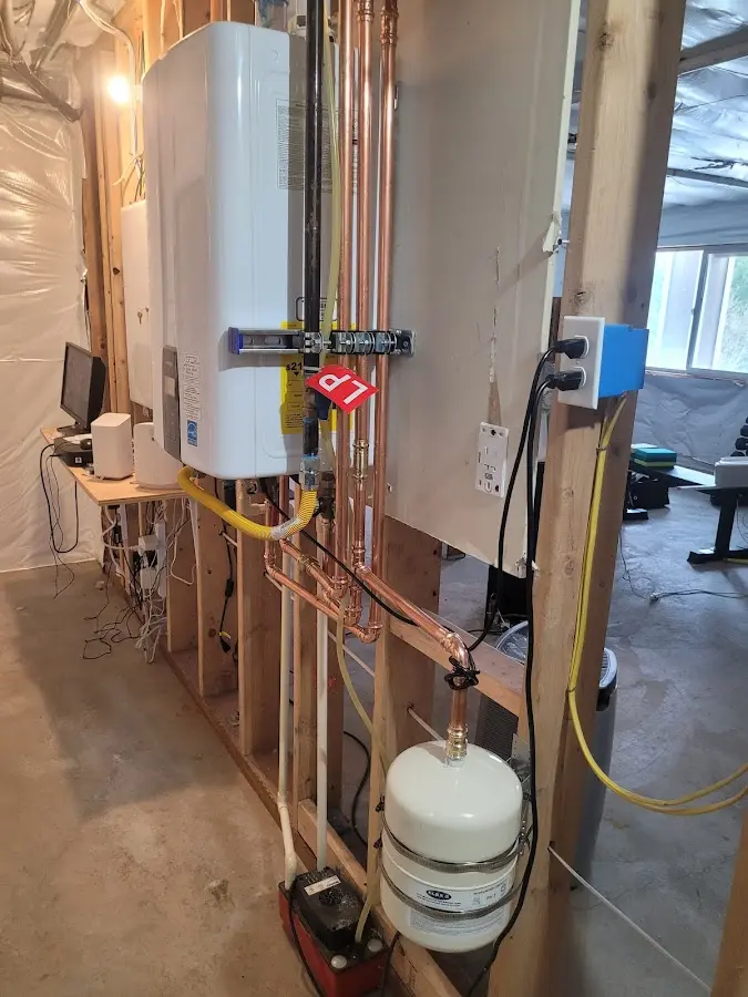 Licensed plumber repairing a kitchen sink in Topeka